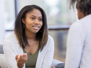 Teenage Girl Talks with Adult